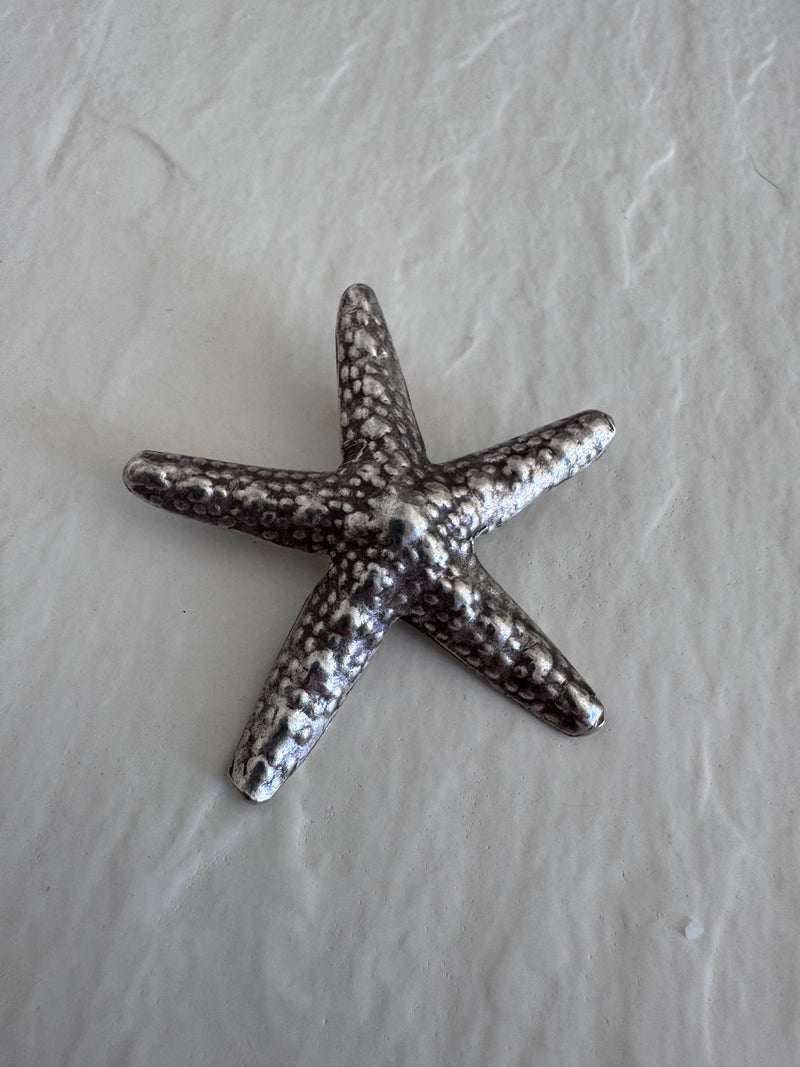 Large Karen Hill Tribe silver starfish pendants with textured surface showing authentic handcrafted details and hidden bail construction