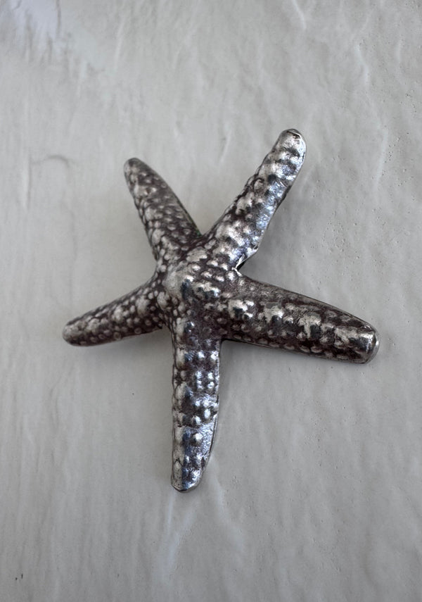 Large Karen Hill Tribe silver starfish pendants with textured surface showing authentic handcrafted details and hidden bail construction