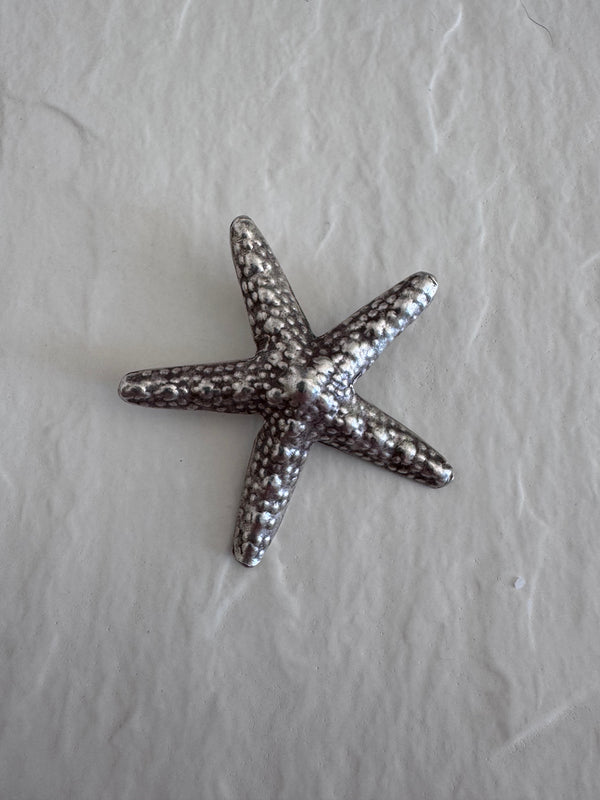 Large Karen Hill Tribe silver starfish pendants with textured surface showing authentic handcrafted details and hidden bail construction