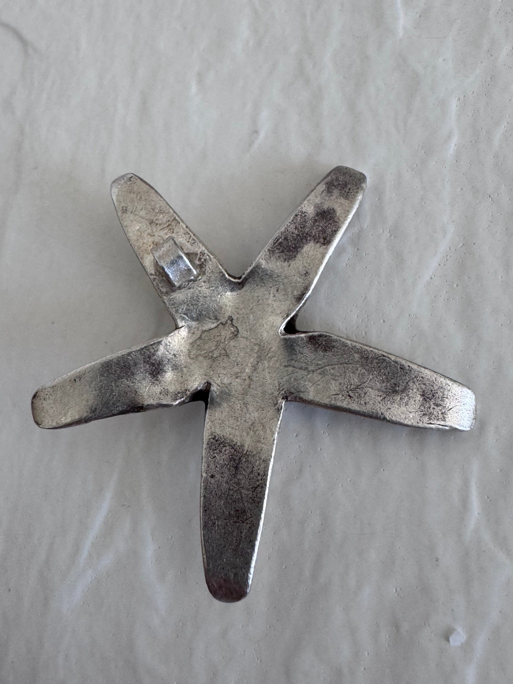 Large Karen Hill Tribe silver starfish pendants with textured surface showing authentic handcrafted details and hidden bail construction