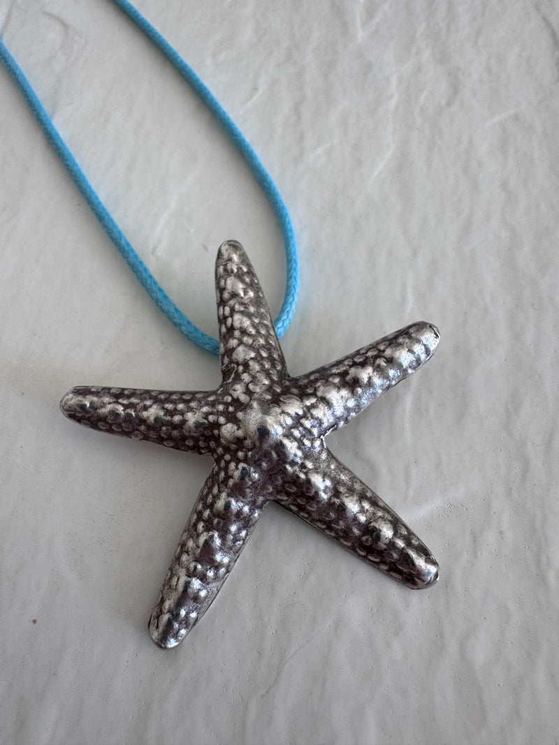 Large Karen Hill Tribe silver starfish pendants with textured surface showing authentic handcrafted details and hidden bail construction