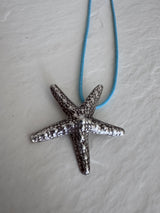 Large Karen Hill Tribe silver starfish pendants with textured surface showing authentic handcrafted details and hidden bail construction
