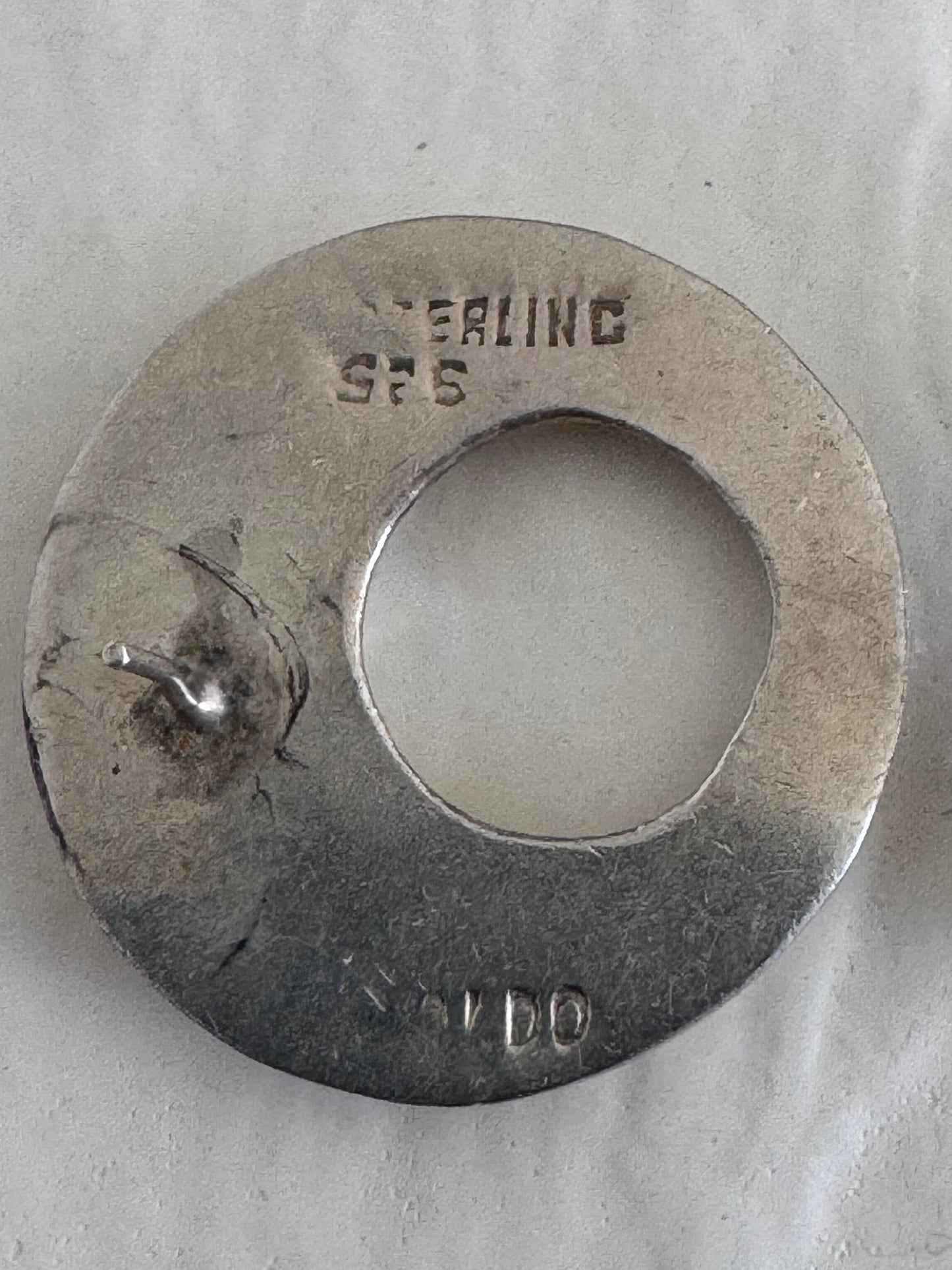 Estate vintage Naldo signed sterling silver modernist donut circle stud earrings showing designer signature and 925 hallmarks