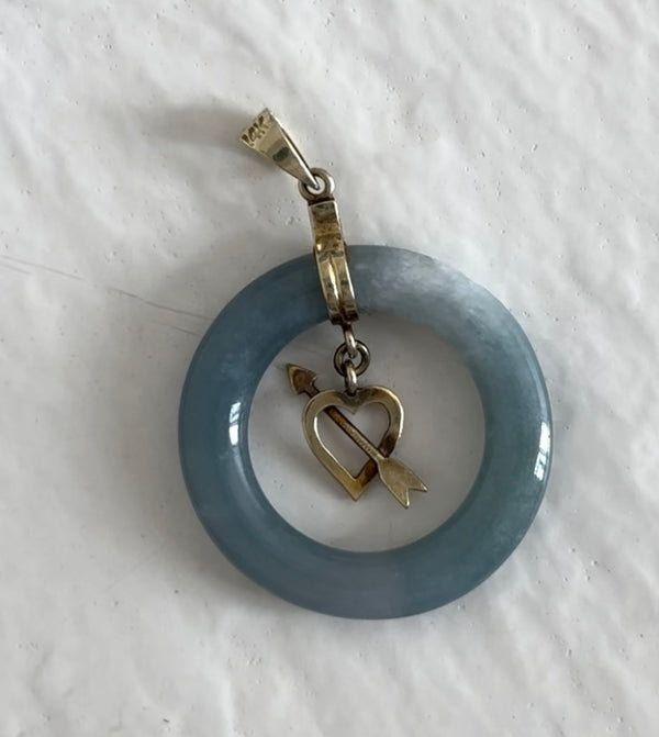 Estate vintage 14K yellow gold blue jadeite circle pendant with heart and arrow motif, showing translucent stone and quality gold framework