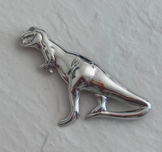 Vintage Taxco sterling silver T-Rex dinosaur brooch with detailed sculptural design and high polish finish