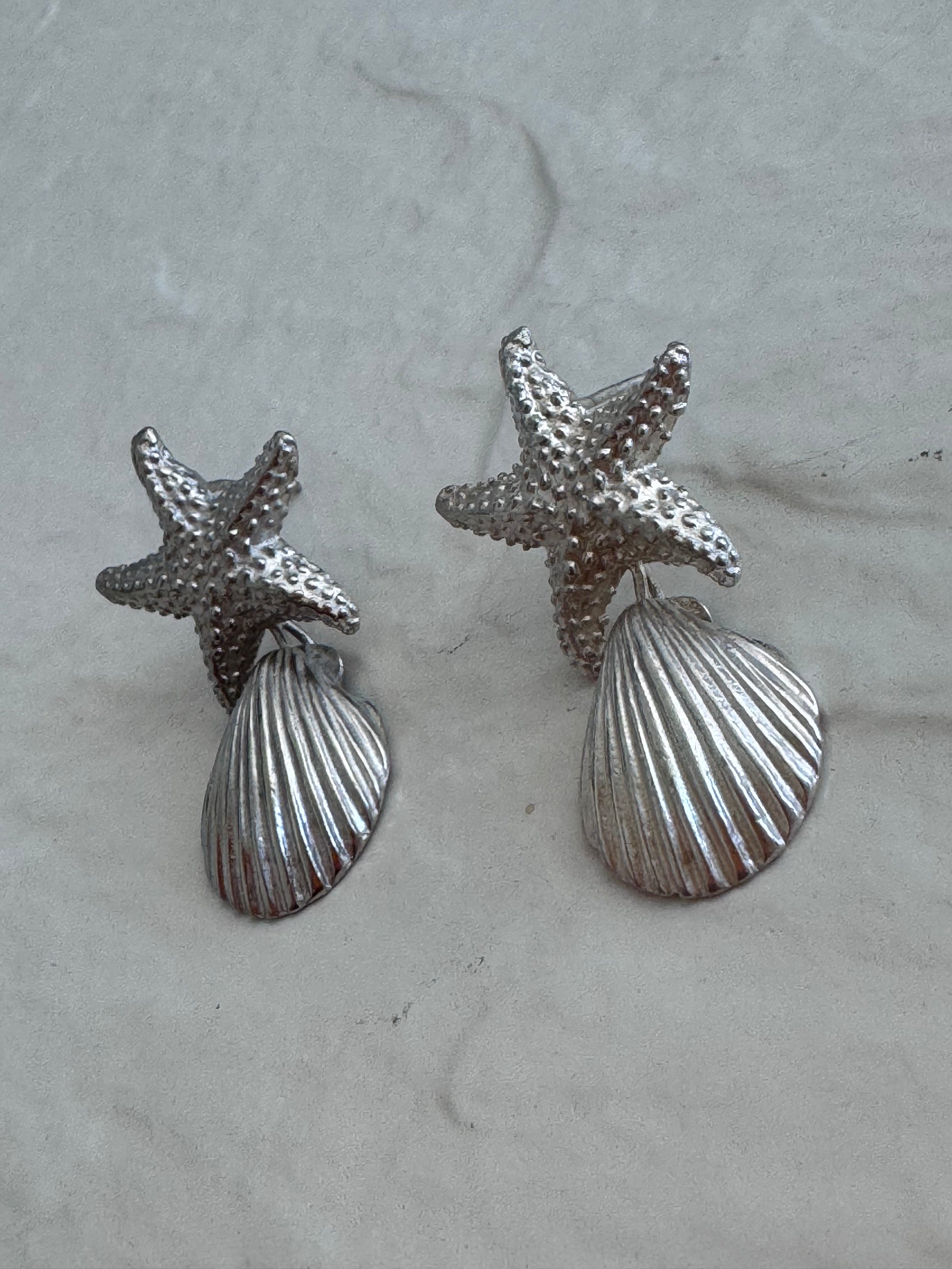 Vintage sterling silver starfish and shell drop earrings with textured detailing and wire connectionsVintage sterling silver starfish and shell drop earrings with textured detailing and wire connections