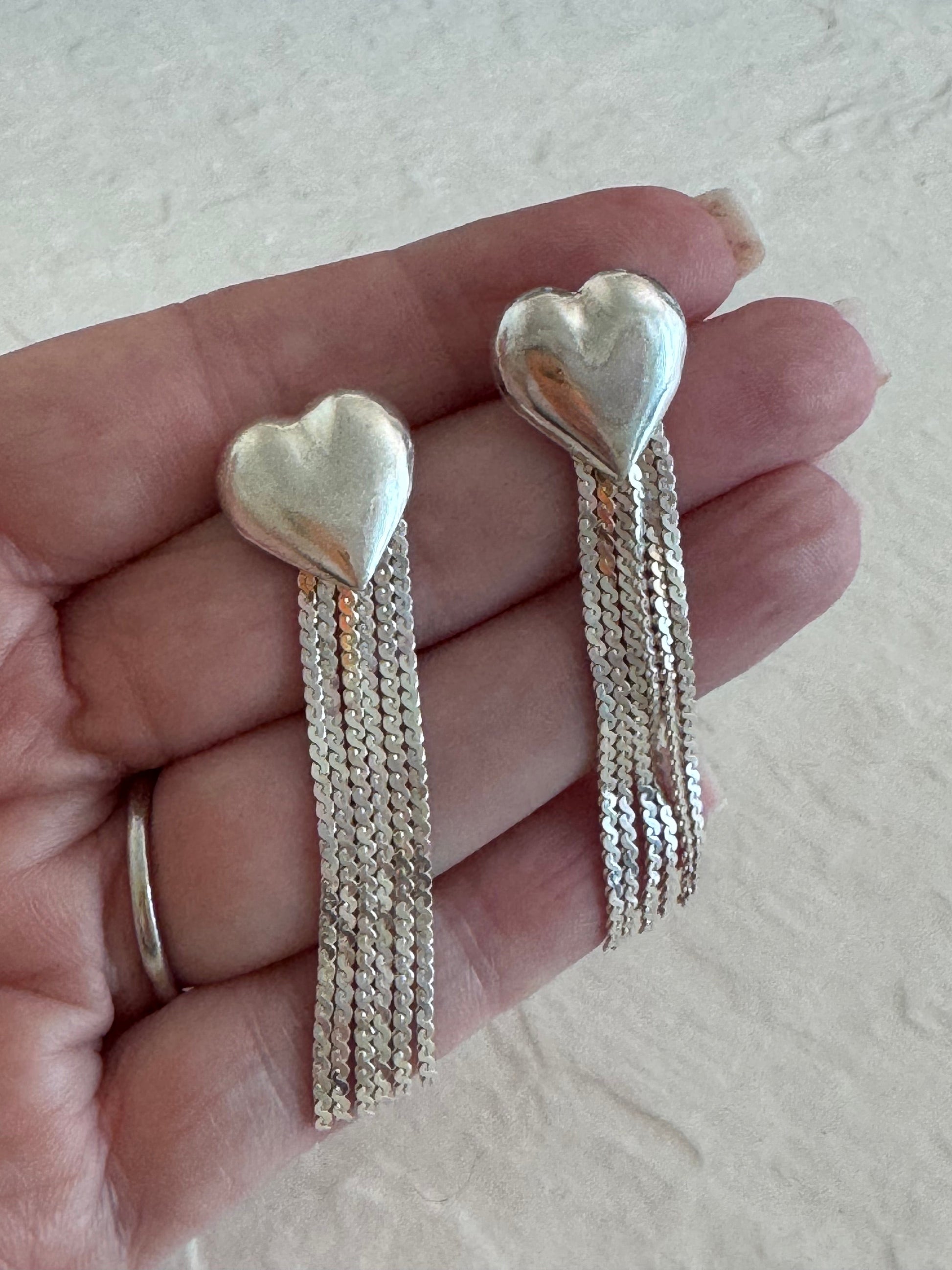 Vintage sterling silver puffy heart earrings with chain tassel fringe, showing 925 hallmarks and never-worn condition