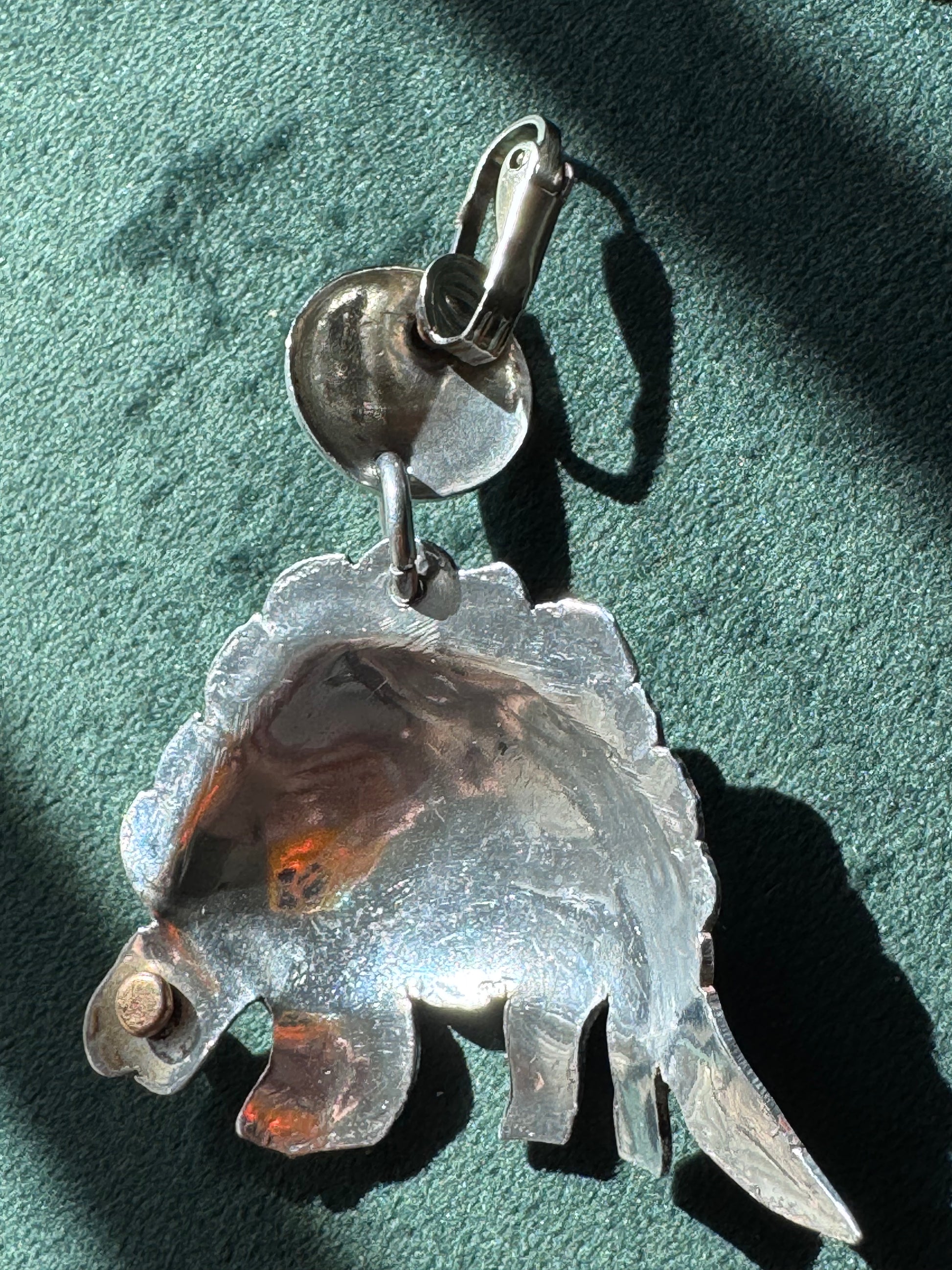 Large vintage silver stegosaurus dinosaur statement dangle clip-on earrings with gold-tone accents, handmade oversized hollow-form construction