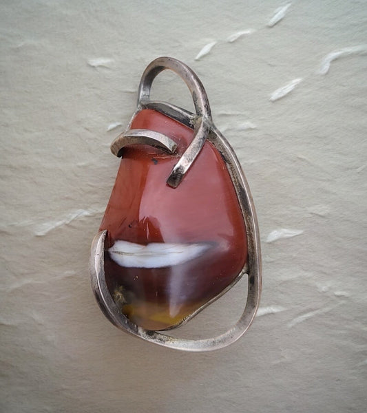 Estate vintage brutalist sterling silver brooch pin pendant with carnelian agate stone in abstract modernist design, dual-purpose jewelry measuring 61mm wide
