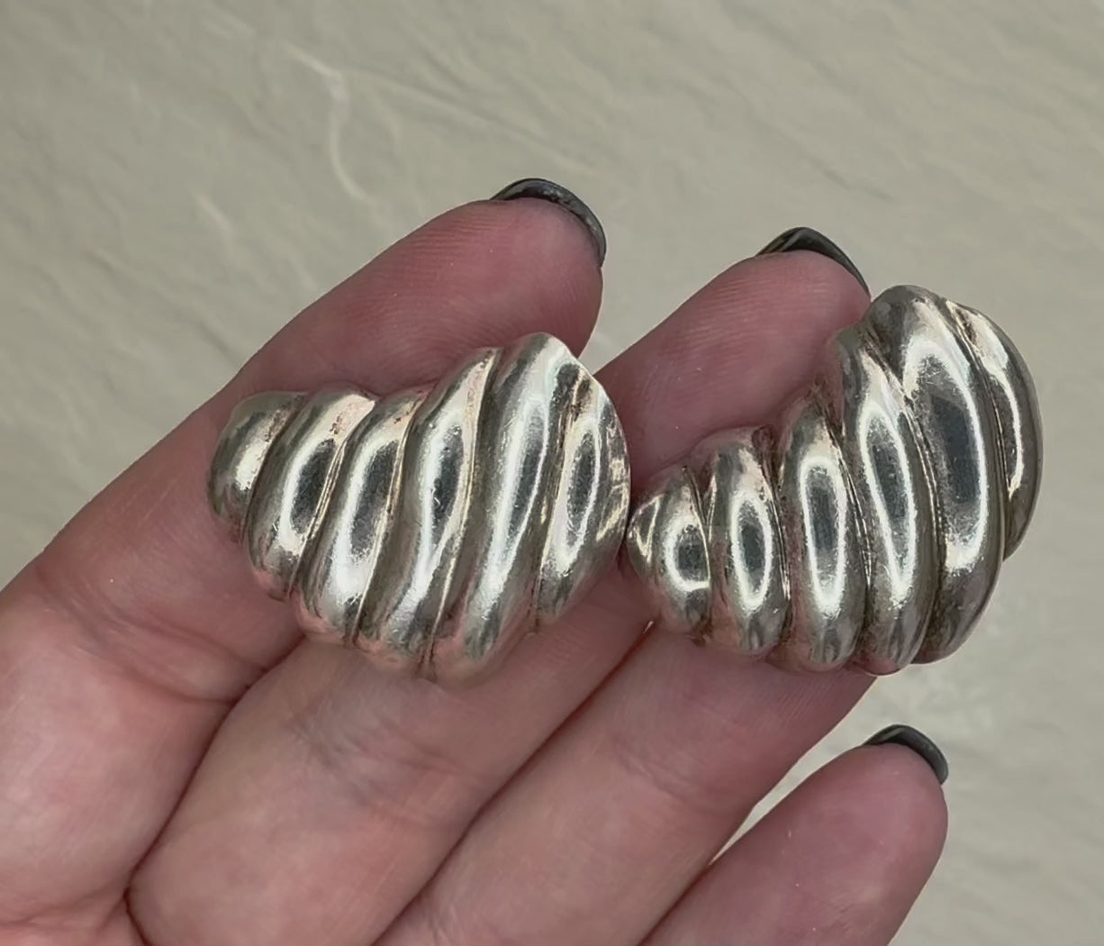 Vintage Mexican sterling silver ribbed puffy heart earrings with dimensional swirl pattern and high polish finish