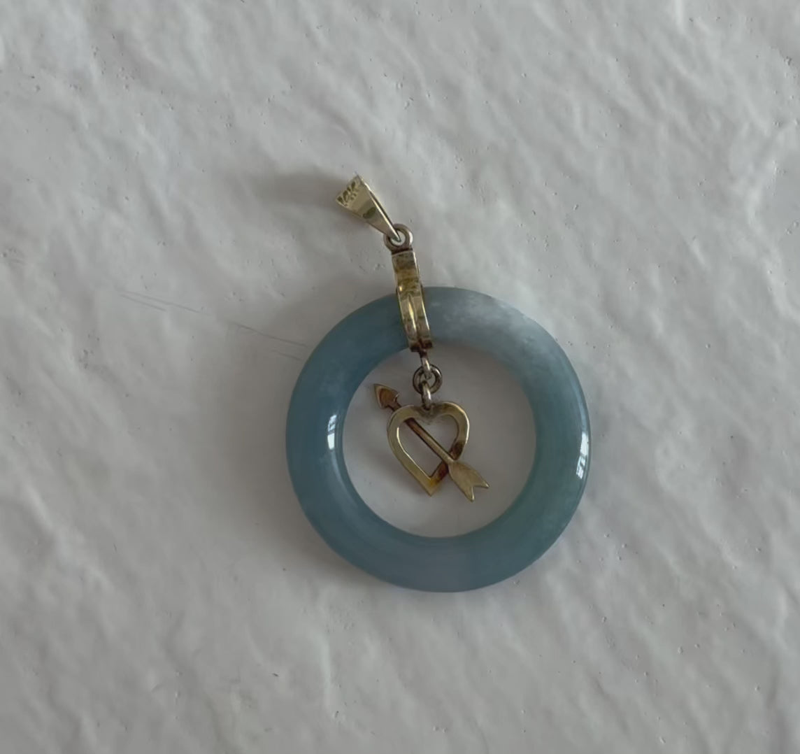 Estate vintage 14K yellow gold blue jadeite circle pendant with heart and arrow motif, showing translucent stone and quality gold framework
