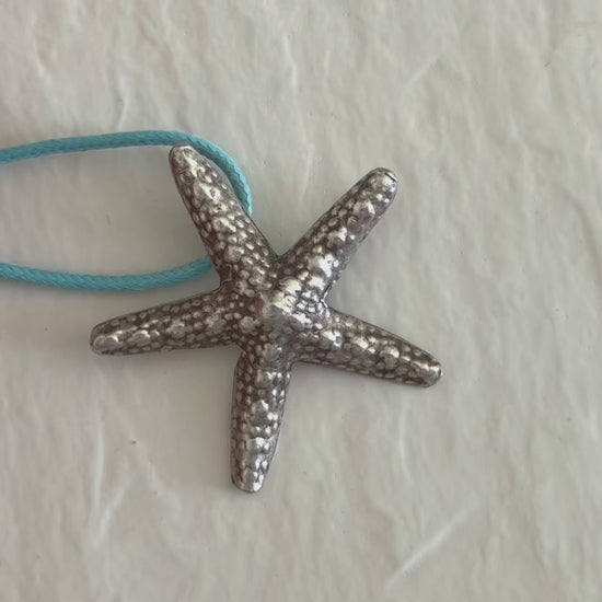 Large Karen Hill Tribe silver starfish pendants with textured surface showing authentic handcrafted details and hidden bail construction