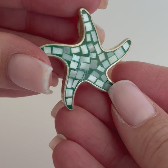 Vintage sterling silver starfish pendant with mother of pearl and green resin mosaic inlay, showing detailed craftsmanship and 925 hallmark