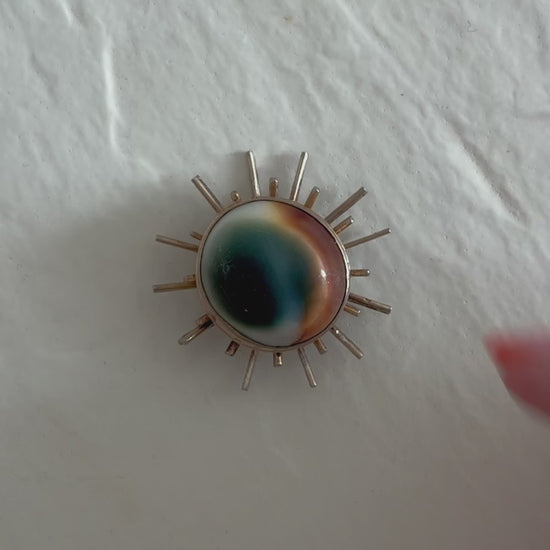1940s sterling silver sunburst pendant with natural operculum center, WWII era modernist design with gold wash