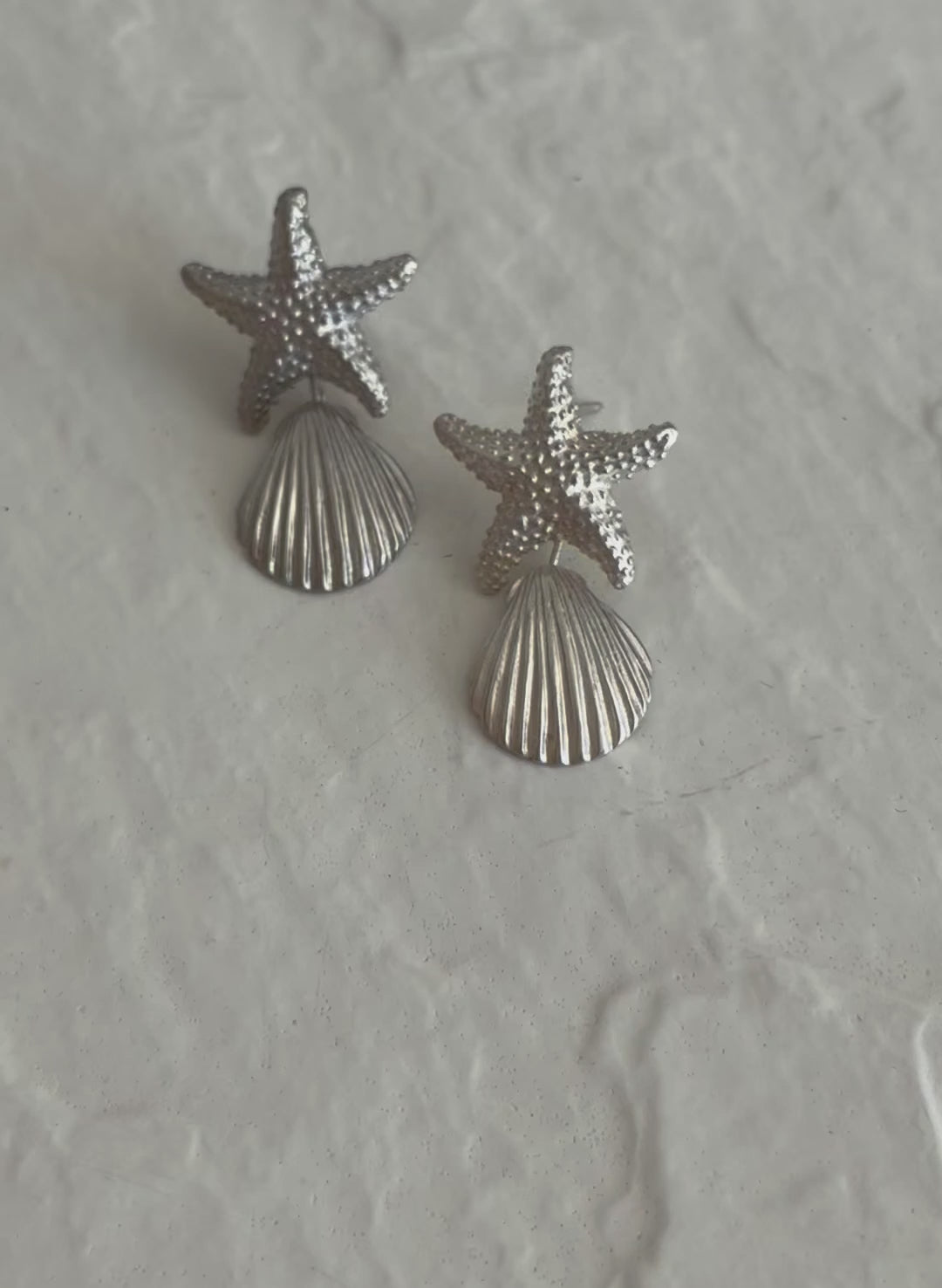 Vintage sterling silver starfish and shell drop earrings with textured detailing and wire connections