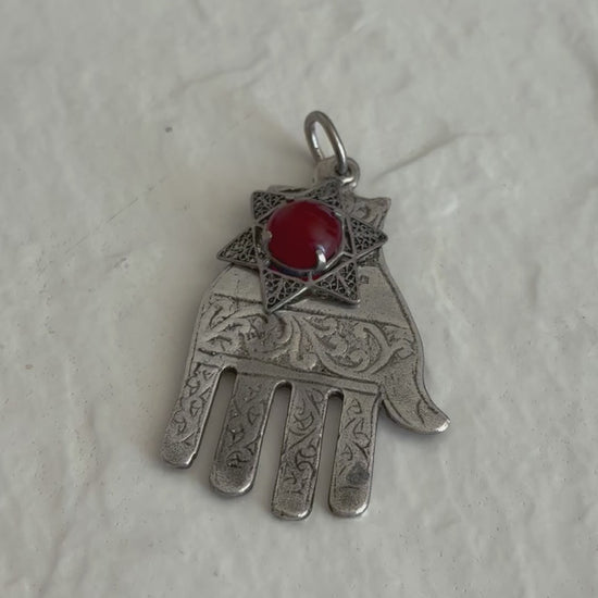 Sterling silver Hamsa hand pendant with Star of David and carnelian stone featuring detailed filigree work and Hebrew text
