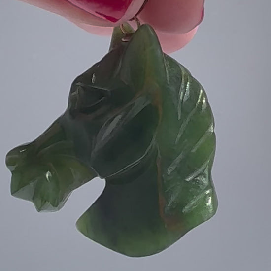 Estate vintage 14K gold pendant featuring hand-carved natural imperial green jadeite horse head with olive undertones, Chinese zodiac equestrian jewelry