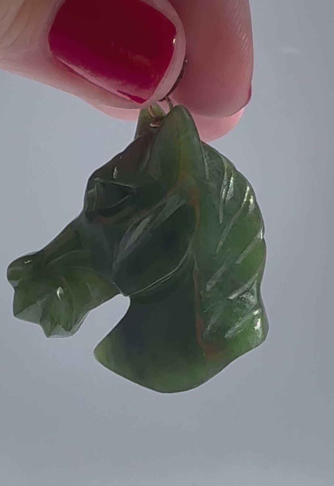 Estate vintage 14K gold pendant featuring hand-carved natural imperial green jadeite horse head with olive undertones, Chinese zodiac equestrian jewelry