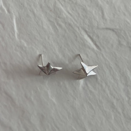 Estate sterling silver dimensional puffy star stud earrings with mirror finish, approximately half inch, showing quality construction