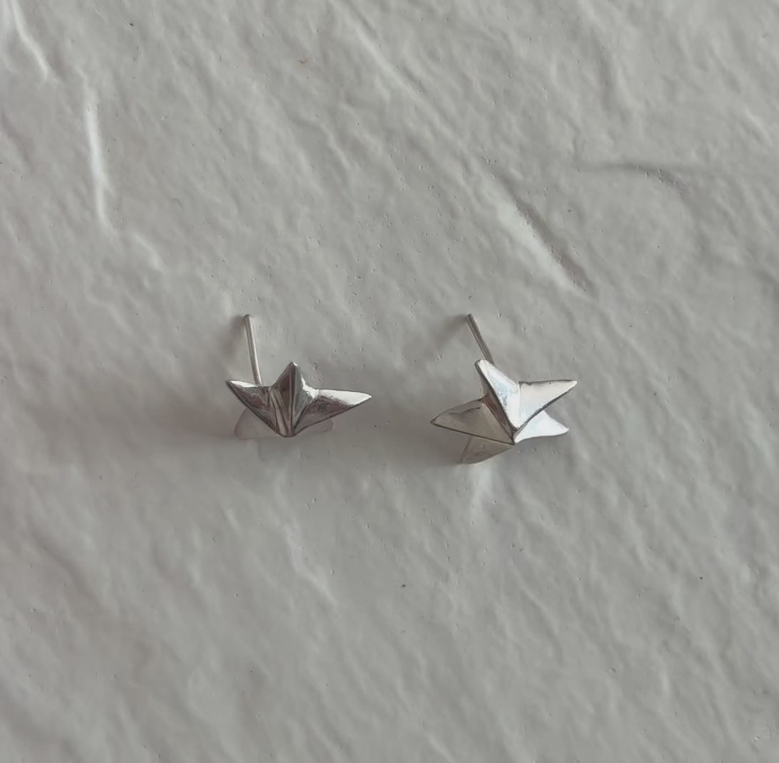 Estate sterling silver dimensional puffy star stud earrings with mirror finish, approximately half inch, showing quality construction